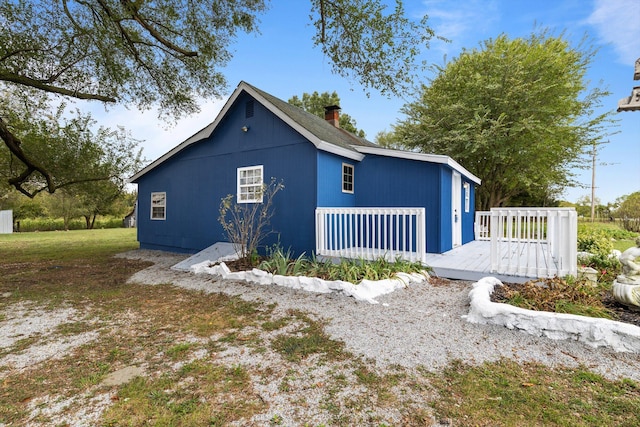 view of home's exterior featuring a deck