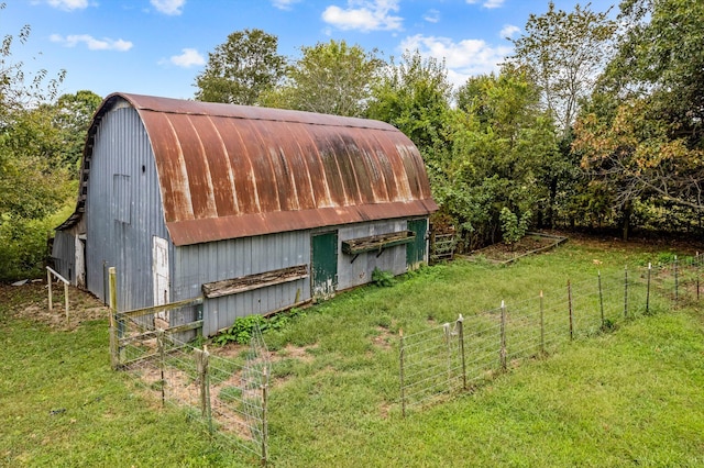 view of outbuilding with a lawn