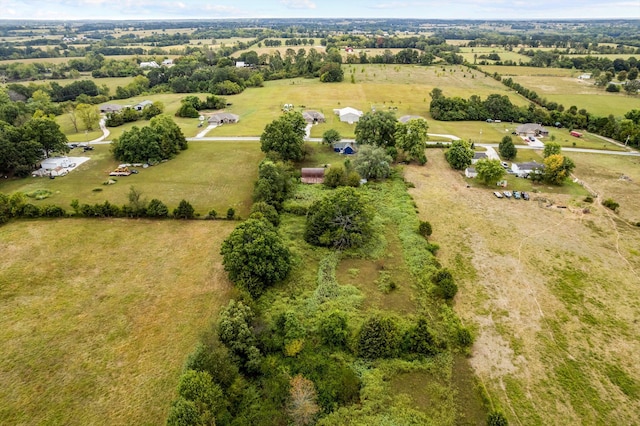 birds eye view of property featuring a rural view