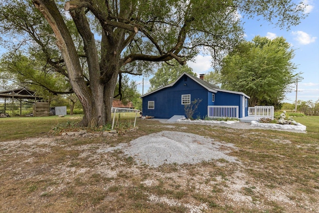 view of side of home with a porch