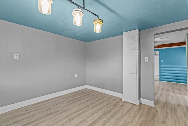 unfurnished room featuring light wood-type flooring