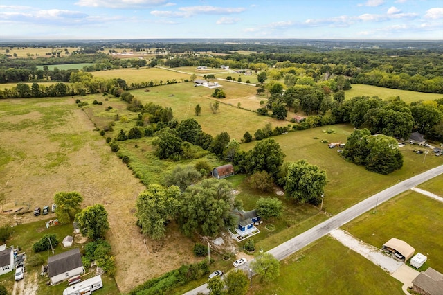 birds eye view of property featuring a rural view