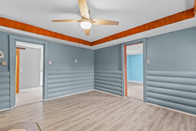 spare room featuring ceiling fan and light wood-type flooring