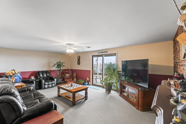 living room featuring carpet floors and ceiling fan