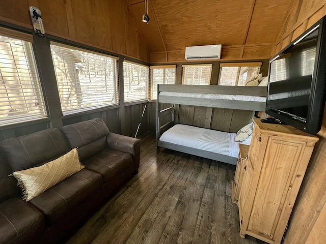 sunroom featuring lofted ceiling, a wall mounted AC, and wood ceiling