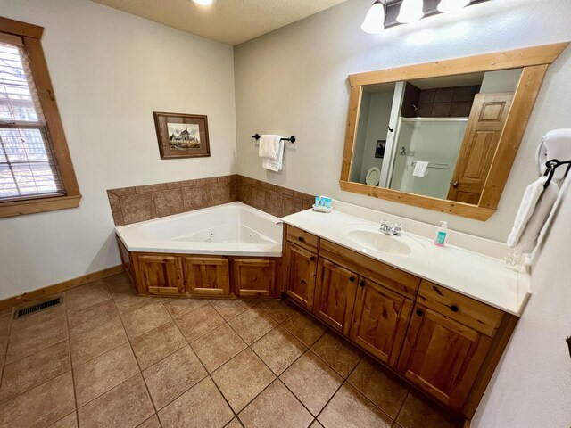 bathroom featuring vanity, visible vents, a shower stall, tile patterned floors, and a tub with jets