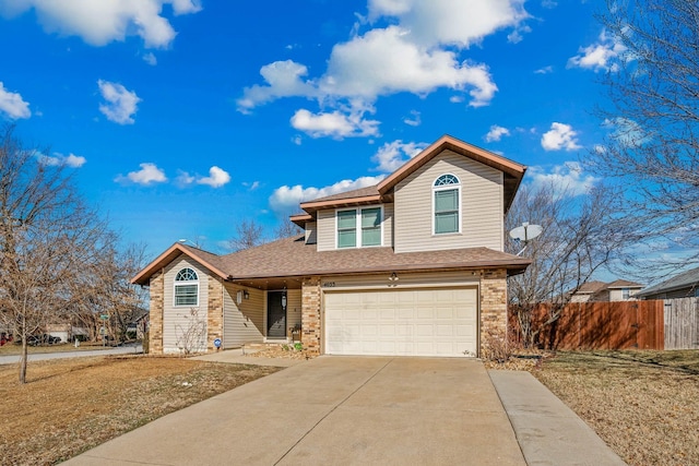 view of front of property with a garage and a front yard