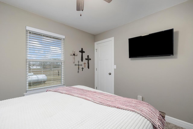 carpeted bedroom with ceiling fan