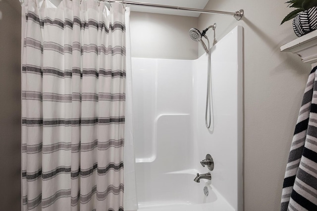 bathroom with shower / bath combo