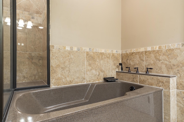 bathroom featuring a tub to relax in