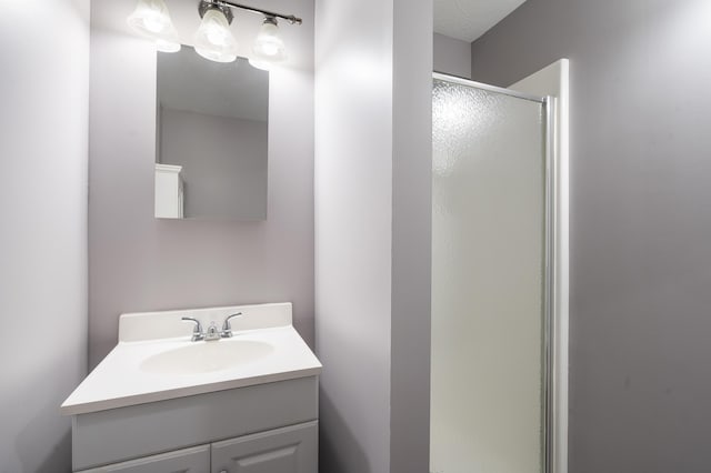 bathroom featuring vanity and walk in shower