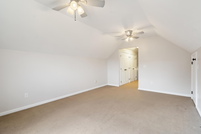 bonus room with ceiling fan, vaulted ceiling, and carpet