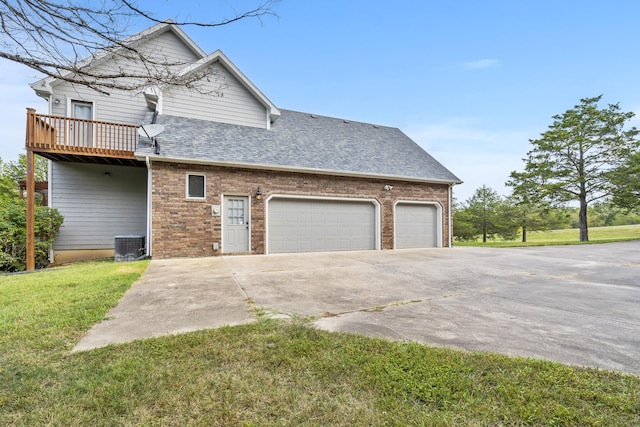 view of property exterior with a garage, central AC, a deck, and a lawn