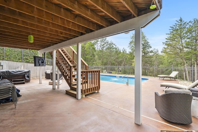 view of patio featuring a fenced in pool