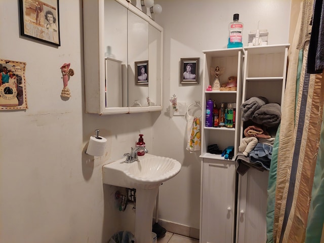 bathroom with tile patterned flooring