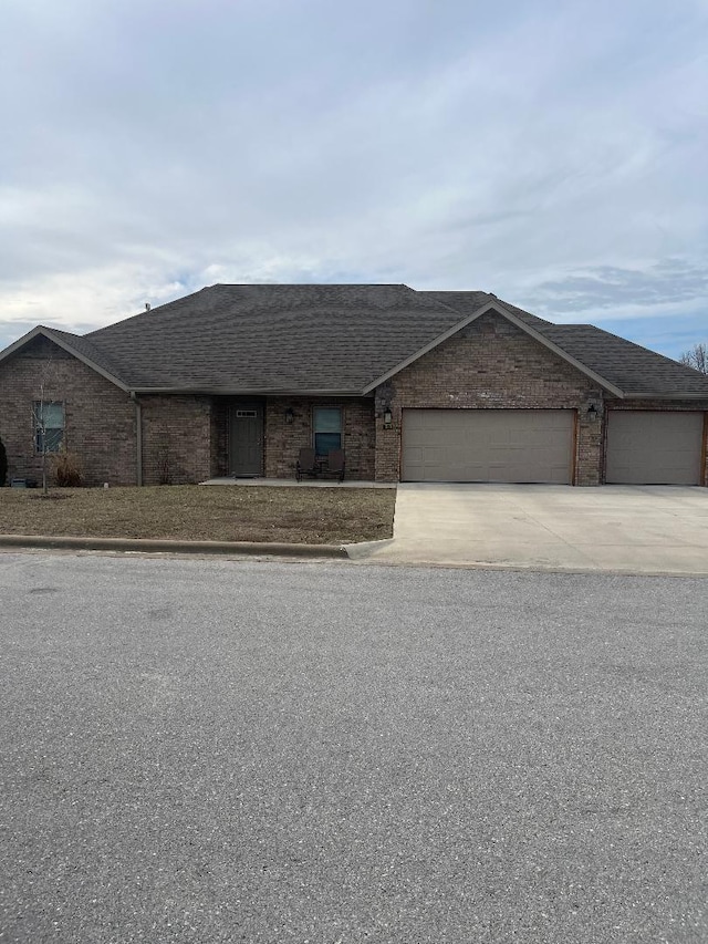 ranch-style house featuring a garage