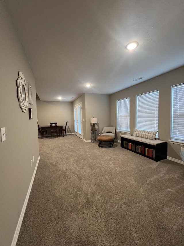 living area with carpet