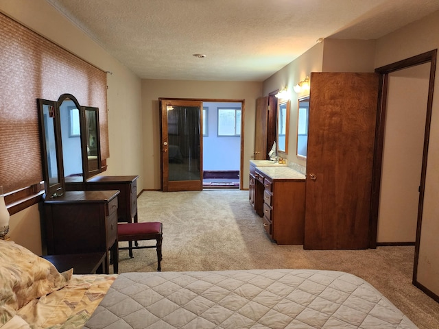 carpeted bedroom with a textured ceiling