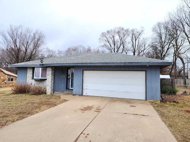 single story home with a garage and a front yard