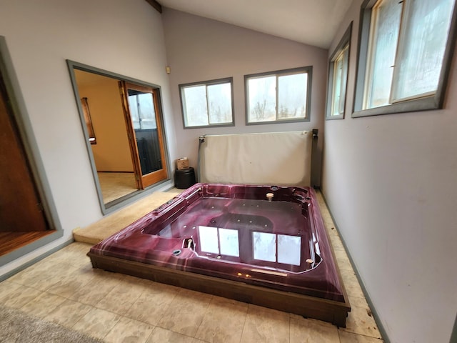 playroom with a jacuzzi and vaulted ceiling