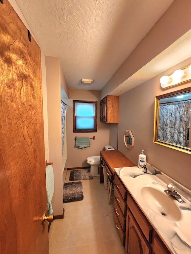 bathroom featuring tile patterned flooring, vanity, a textured ceiling, curtained shower, and toilet