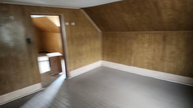 bonus room featuring vaulted ceiling