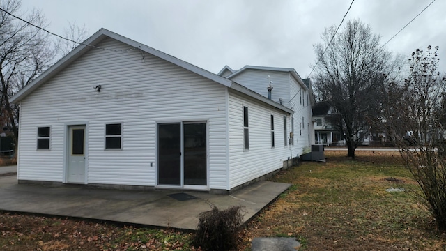 rear view of property with a patio area and a lawn