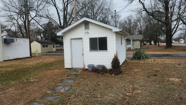 view of outdoor structure with a yard