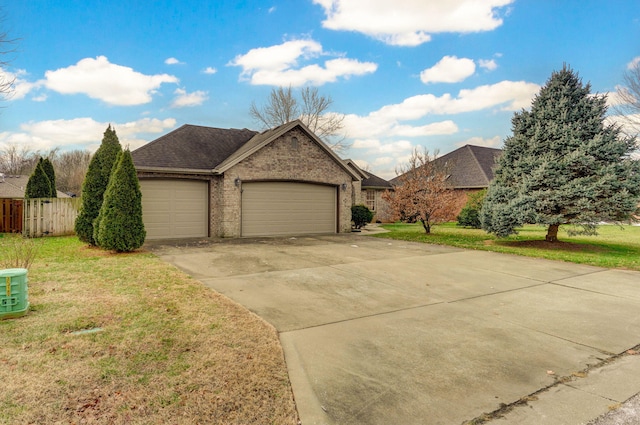 view of front facade with a garage and a front yard