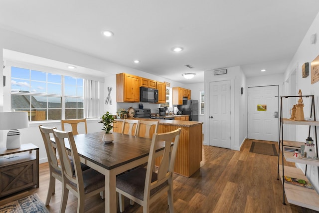 dining room with dark wood-type flooring