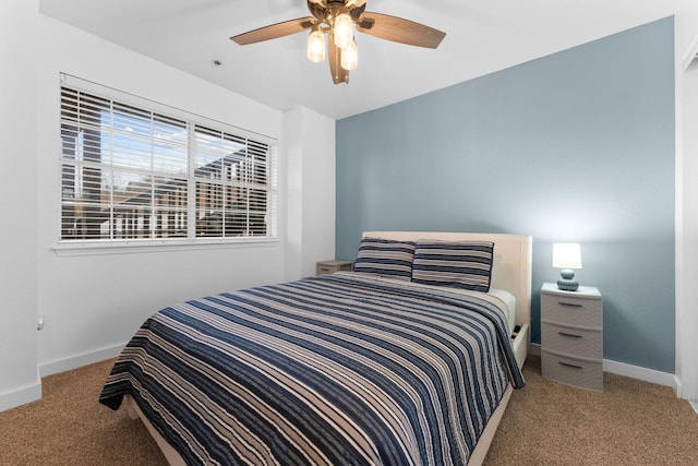 bedroom featuring ceiling fan and light colored carpet