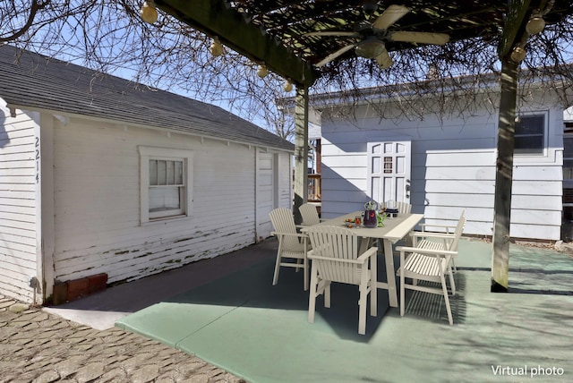 view of patio / terrace with a ceiling fan and outdoor dining space