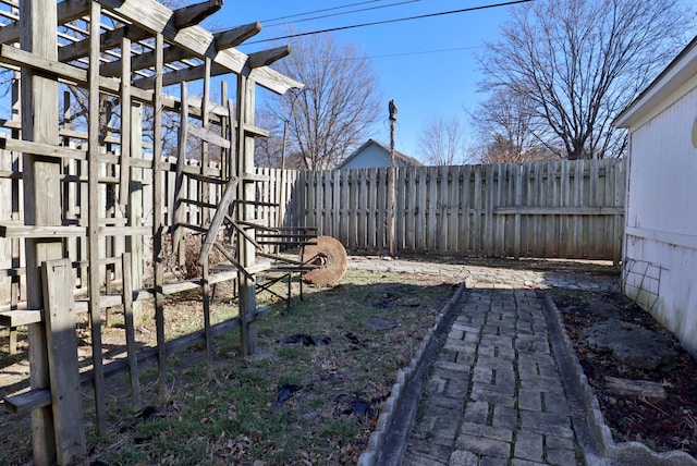 view of yard featuring a fenced backyard and a pergola