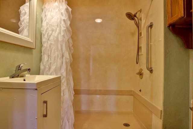 bathroom featuring vanity and a shower with shower curtain