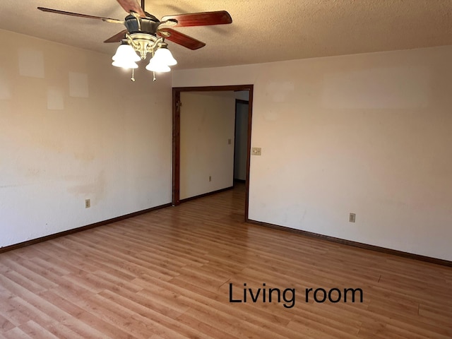 unfurnished room with ceiling fan, a textured ceiling, and light hardwood / wood-style flooring