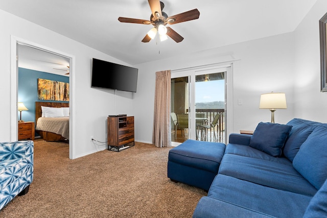 living room featuring lofted ceiling, carpet floors, and ceiling fan