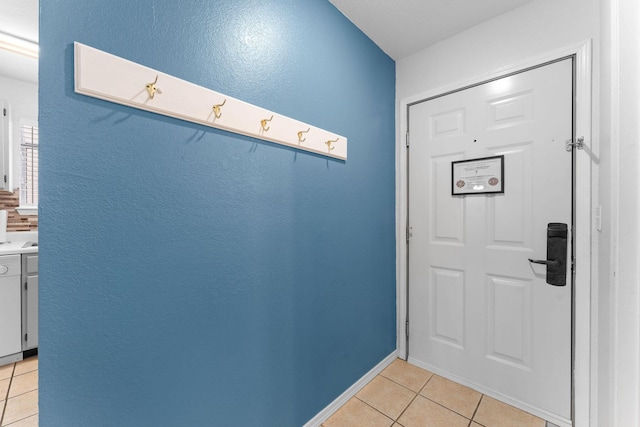 doorway to outside featuring light tile patterned floors