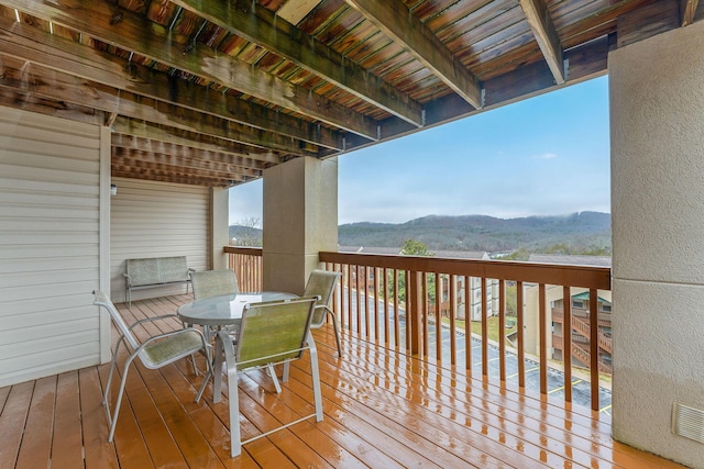 wooden deck featuring a mountain view