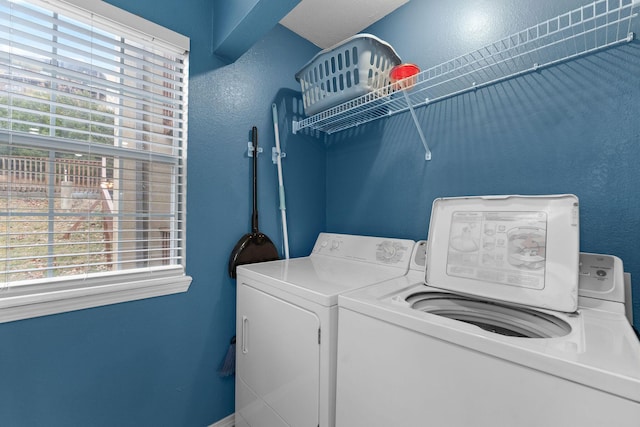 laundry area with washing machine and dryer