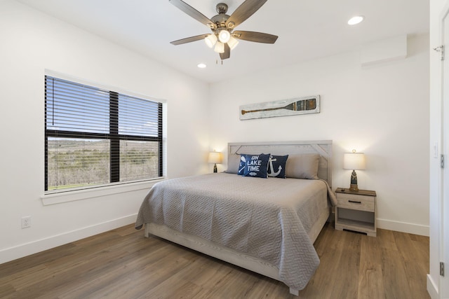 bedroom with hardwood / wood-style floors and ceiling fan