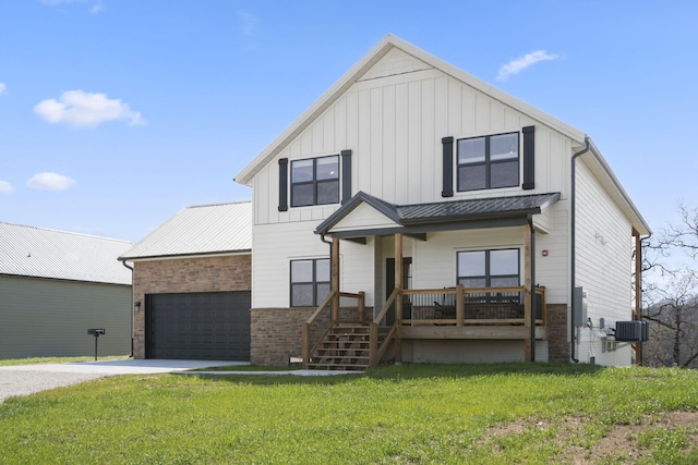 modern farmhouse style home with a porch, a garage, a front yard, and central air condition unit