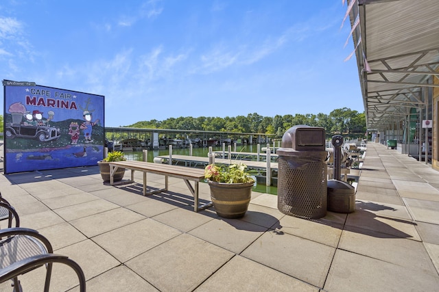 view of property's community with a dock and a water view