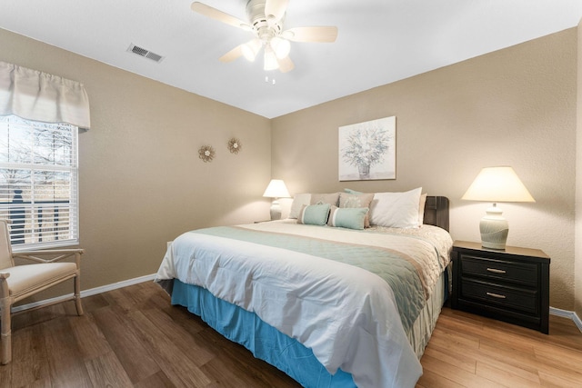 bedroom with hardwood / wood-style flooring and ceiling fan