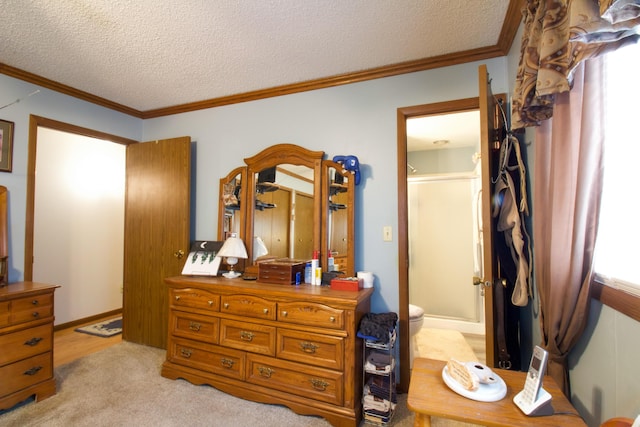 carpeted bedroom featuring crown molding and a textured ceiling