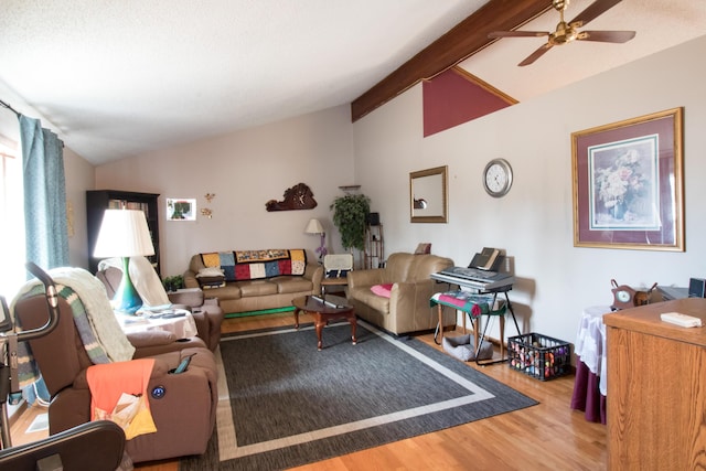 living room with vaulted ceiling with beams, wood-type flooring, and ceiling fan