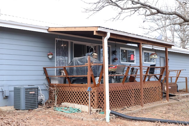 exterior space with a wooden deck and central air condition unit