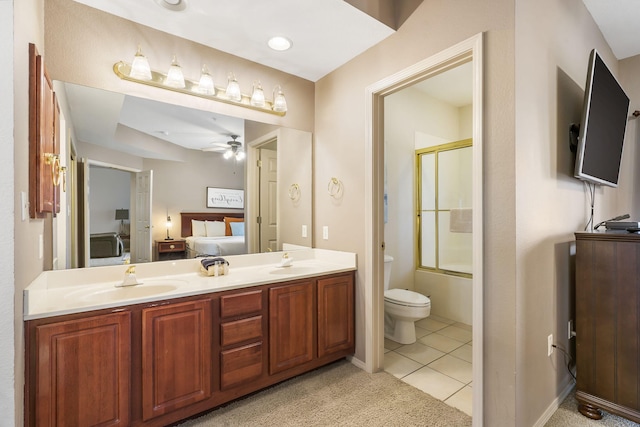 full bathroom with enclosed tub / shower combo, vanity, ceiling fan, toilet, and tile patterned floors