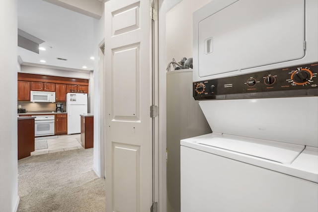 washroom featuring stacked washer / drying machine and light colored carpet