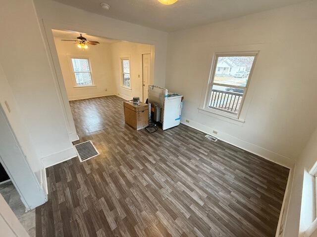 spare room featuring dark hardwood / wood-style floors and ceiling fan