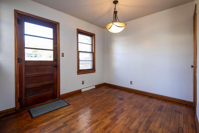 foyer featuring a baseboard radiator and dark wood-type flooring